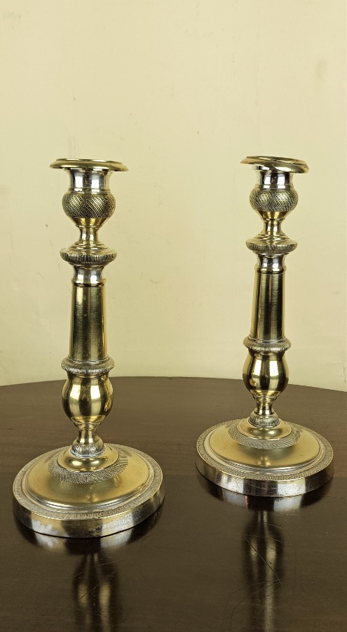 Pair of French Napoleon III brass candlesticks with sharp knurled pattern details